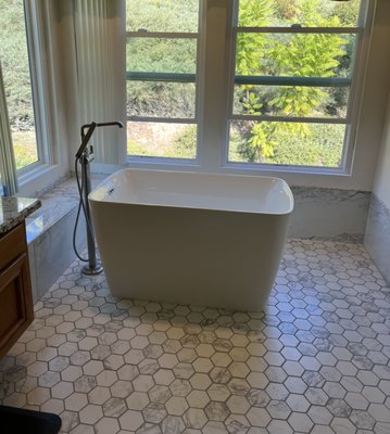 Bathroom Remodel - This remodel was done on an old shower that was in bad shape and we converted it into a curb-less shower. We also replace the existing tub for a new freestanding bathtub.