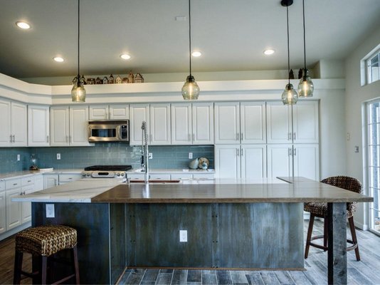Jodi's Kitchen - Jodi’s kitchen was rescue project. She had hired a discount contractor to start the kitchen remodel but the contractor had made a ton of mistakes and Jodi ended up having to fire him.
Along with our good friends at DesignCents, we end up cleaning up the messes and helped Jodi achieve the vision she had in the first place. The island countertop combination of wood and stone made this project extremely unique. Our craftsmen, Andrew and Bryan, did an amazing job marrying the two materials together seamlessly. Jodi's Kitchen - Jodi’s kitchen was rescue project. She had hired a discount contractor to start the kitchen remodel but the contractor had made a ton of mistakes and Jodi ended up having to fire him.
Along with our good friends at DesignCents, we end up cleaning up the messes and helped Jodi achieve the vision she had in the first place. The island countertop combination of wood and stone made this project extremely unique. Our craftsmen, Andrew and Bryan, did an amazing job marrying the two materials together seamlessly.