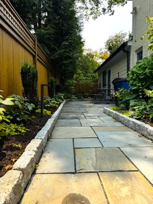 LED Lighting Installation - Our client envisioned a warm, elegant glow to accentuate the beauty of her flowerbed area during the evening hours. To bring this vision to life, we installed premium low-voltage LED lighting, carefully positioned to highlight the natural contours of the flowerbeds and surrounding landscape. The result is a graceful nighttime ambiance that enhances curb appeal and adds charm to the outdoor space.