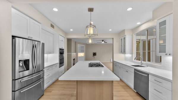 Full House Remodeling - Carlsbad - This complete home transformation in Carlsbad includes a brand-new kitchen and three fully remodeled bathrooms. The design blends white cabinets with natural oak cabinetry, creating a clean modern look with warm, natural elements throughout the house.

We installed oak-tone luxury vinyl flooring to enhance the cozy feel while offering durability and style. Every room was thoughtfully updated to feel fresh, functional, and beautifully cohesive. A truly stunning full-house remodel that brings comfort and contemporary design together.