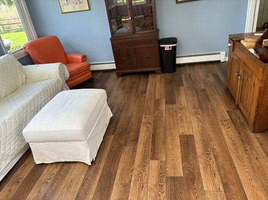 This was a luxury vinyl plank install - This was of a living room sunroom and hallways that were outdated with old carpet. Customer wanted luxury vinyl plank installed with shoe molding This was a luxury vinyl plank install - This was of a living room sunroom and hallways that were outdated with old carpet. Customer wanted luxury vinyl plank installed with shoe molding