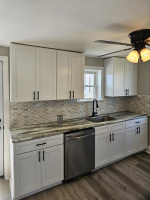 Kitchen Remodel - We turned this outdated kitchen into a modern masterpiece. By installing custom white shaker cabinets, sleek granite countertops, and premium hardware, we created a space that is as functional as it is beautiful. From the improved layout to the high-end finishes, this kitchen is now the true heart of the home. At JDW Property Solutions, we don't just remodel—we reinvent your living space. Ready for your own transformation? Request a quote today!