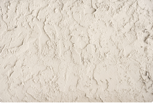 TYPES OF STUCCO - TRADITIONAL STUCCO
Made of sand, lime, and water, is now often mixed with cement for durability. Lime makes it easier to mold, while additives like glass fibers and acrylics enhance strength. Without a stable mesh base, pure cement stucco can crack. When applied and maintained properly, stucco can last about 50 years and offers versatile texture options.
SYNTHETIC STUCCO
Unlike traditional stucco, synthetics does not use cement and lime. Rather, synthetics use acrylic resin that is resistant to water damage. Synthetic stucco dries evenly, quickly, and can be applied over foam board, rather then over mesh. The acrylic resin also adds movement to stucco, making it less prone to cracking and breaking. TYPES OF STUCCO - TRADITIONAL STUCCO
Made of sand, lime, and water, is now often mixed with cement for durability. Lime makes it easier to mold, while additives like glass fibers and acrylics enhance strength. Without a stable mesh base, pure cement stucco can crack. When applied and maintained properly, stucco can last about 50 years and offers versatile texture options.
SYNTHETIC STUCCO
Unlike traditional stucco, synthetics does not use cement and lime. Rather, synthetics use acrylic resin that is resistant to water damage. Synthetic stucco dries evenly, quickly, and can be applied over foam board, rather then over mesh. The acrylic resin also adds movement to stucco, making it less prone to cracking and breaking.