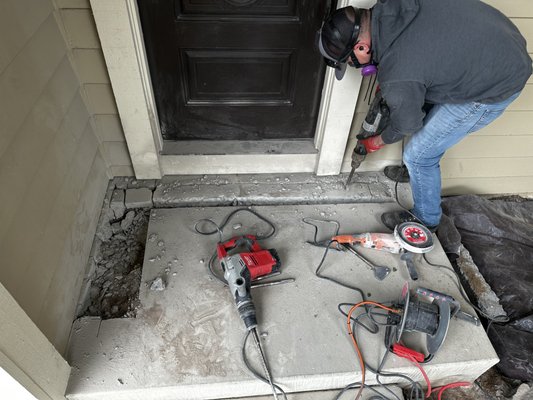 Termite job needing concrete removal - This house had termites coming up from under the front concrete porch and the customer saw them coming out of an electrical outlet! We determined the porch which had dirt fill under the concrete had an issue. The dirt fill was above the wood framing members, it was built this way but the original contractor put metal flashing to prevent the dirt from touching the wood. The only problem was that the metal flashing was deteriorating and allowing soil into the wood in the subarea, thus allowing termites in. So we cut out a portion of the concrete, treated the soil below, added new flashing and then poured concrete where there was once dirt. This helps ensure termites won't come back (at least not for a very long time). We also treated the whole perimeter to be on the safe side and warrant the house. Most companies will only treat this area and most inspectors don't even realize that in cases like this termites can sometimes return after treatment if you don't employ this method. Termite job needing concrete removal - This house had termites coming up from under the front concrete porch and the customer saw them coming out of an electrical outlet! We determined the porch which had dirt fill under the concrete had an issue. The dirt fill was above the wood framing members, it was built this way but the original contractor put metal flashing to prevent the dirt from touching the wood. The only problem was that the metal flashing was deteriorating and allowing soil into the wood in the subarea, thus allowing termites in. So we cut out a portion of the concrete, treated the soil below, added new flashing and then poured concrete where there was once dirt. This helps ensure termites won't come back (at least not for a very long time). We also treated the whole perimeter to be on the safe side and warrant the house. Most companies will only treat this area and most inspectors don't even realize that in cases like this termites can sometimes return after treatment if you don't employ this method.