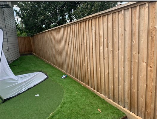 Elegant Custom Wood Privacy Fence Installation - For this home improvement project, we designed and installed a high-quality wooden privacy fence to enhance security, curb appeal, and functionality. The project involved a full replacement of the existing fencing, upgrading to durable, pressure-treated wood for long-lasting performance.
• Custom Design: The project included a mix of vertical board-on-board and horizontal slat styles, providing a modern yet natural aesthetic.
• Structural Reinforcement: The fence was reinforced with treated posts and a sturdy base to prevent shifting, leaning, or warping over time.
• Elegant Finishing Touches: A decorative top rail and arched paneling were incorporated for a refined appearance that blends seamlessly with the home’s landscape.
• Improved Privacy & Security: The overlapping board design eliminates gaps, maximizing privacy while adding a sophisticated visual appeal. Elegant Custom Wood Privacy Fence Installation - For this home improvement project, we designed and installed a high-quality wooden privacy fence to enhance security, curb appeal, and functionality. The project involved a full replacement of the existing fencing, upgrading to durable, pressure-treated wood for long-lasting performance.
• Custom Design: The project included a mix of vertical board-on-board and horizontal slat styles, providing a modern yet natural aesthetic.
• Structural Reinforcement: The fence was reinforced with treated posts and a sturdy base to prevent shifting, leaning, or warping over time.
• Elegant Finishing Touches: A decorative top rail and arched paneling were incorporated for a refined appearance that blends seamlessly with the home’s landscape.
• Improved Privacy & Security: The overlapping board design eliminates gaps, maximizing privacy while adding a sophisticated visual appeal.