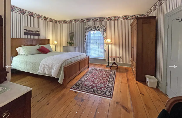 Room Two - “Rose Room” - Our peaceful, two-windowed, corner “Rose” of a room has beautiful vintage wallpaper, an exceptionally comfortable queen bed, a large armoire, and a lovely sitting area. The ensuite bathroom with a tub/shower combination, features an original brick wall, adding even more character and originality to this often-requested suite. Room Two - “Rose Room” - Our peaceful, two-windowed, corner “Rose” of a room has beautiful vintage wallpaper, an exceptionally comfortable queen bed, a large armoire, and a lovely sitting area. The ensuite bathroom with a tub/shower combination, features an original brick wall, adding even more character and originality to this often-requested suite.