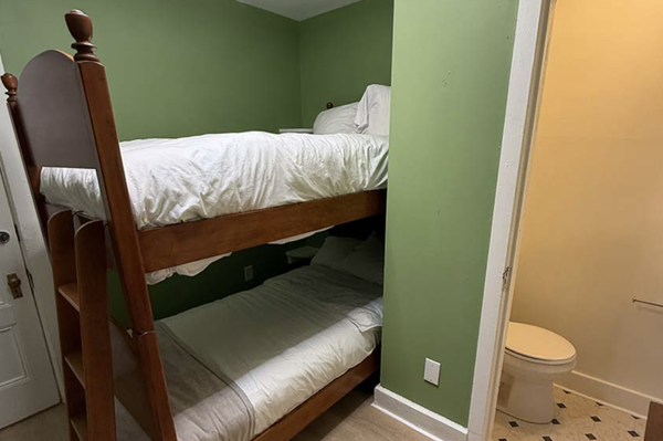 Twin Bunk Beds (as low as $86/night) - Room has individual climate control, TV, mini fridge, in-room half bath (toilet and sink), but separate individual private locked single showers available throughout the building.

Sleeps 2
2 Twin beds
1 Bathroom
110ft²
Non-smoking
Mini Fridge
Smart TV
Wireless Internet
Air-conditioned
Hair Dryer (upon request)