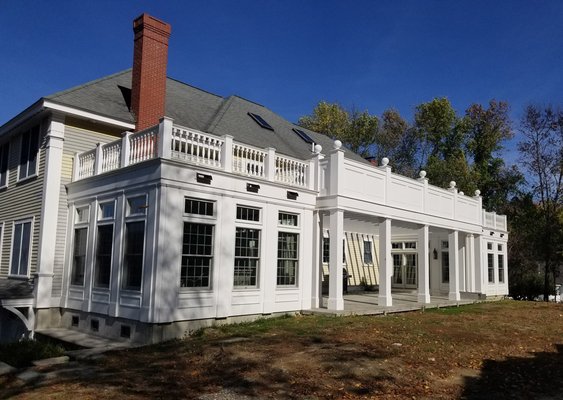 Carriage House, Sunrooms, and Terrace Additions to a Georgian Home - The Savoys wanted to enjoy their expansive rear yard. This addition adds sunrooms and an outdoor terrace rich in detail that keeps with the Georgian style of the home.