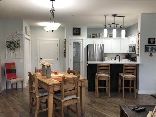 Condo Kitchen - The client was ready to update their kitchen and give the space a fresh new feel. By sanding and repainting the cabinets, installing new countertops and a new backsplash, and upgrading the appliances. The kitchen was transformed into a welcoming and functional space for everyday use.
