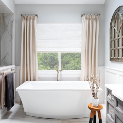 Timeless Design for a Functional Family Home - "This beautifully curated home highlights the art of thoughtful design through the seamless integration of custom window treatments and sophisticated decor elements across every room. From serene bedrooms to a refined living room, a productive home office, and a spa-like bathroom, each space has been styled to elevate both function and ambiance.The unifying theme throughout the home is a commitment to layering textures, mixing timeless materials, and choosing window solutions that complement architectural details. A balanced color palette of soft neutrals, warm earth tones, and classic greys creates a cohesive flow while allowing each room its own personality and purpose.Full-length drapery panels, plantation shutters, Roman shades, and modern horizontal sheers have been carefully selected for their ability to manage light and privacy while adding visual softness and height to each space. These treatments not only enhance aesthetics but also support day-to-day livability.Key design choices include:Soft neutral backdrops that allow for rich textures and curated furnishings to take center stage.Tailored drapery and sleek shades, layered where appropriate, to enhance depth and dimension.Elegant architectural framing using millwork, arched windows, and ceiling height to elevate the sense of space.Natural materials and finishes, such as linen, wood, and marble, adding warmth and organic balance.Comfort-forward furniture that remains refined, including plush seating, statement mirrors, and artisanal accents.Customized solutions for every room—whether it's blackout functionality in a bedroom, diffused natural light in a living space, or moisture-resistant treatments in a bathroom.The result is a home that feels unified and calm, yet never sterile—each room grounded in its own design story while maintaining continuity throughout. " Timeless Design for a Functional Family Home - "This beautifully curated home highlights the art of thoughtful design through the seamless integration of custom window treatments and sophisticated decor elements across every room. From serene bedrooms to a refined living room, a productive home office, and a spa-like bathroom, each space has been styled to elevate both function and ambiance.The unifying theme throughout the home is a commitment to layering textures, mixing timeless materials, and choosing window solutions that complement architectural details. A balanced color palette of soft neutrals, warm earth tones, and classic greys creates a cohesive flow while allowing each room its own personality and purpose.Full-length drapery panels, plantation shutters, Roman shades, and modern horizontal sheers have been carefully selected for their ability to manage light and privacy while adding visual softness and height to each space. These treatments not only enhance aesthetics but also support day-to-day livability.Key design choices include:Soft neutral backdrops that allow for rich textures and curated furnishings to take center stage.Tailored drapery and sleek shades, layered where appropriate, to enhance depth and dimension.Elegant architectural framing using millwork, arched windows, and ceiling height to elevate the sense of space.Natural materials and finishes, such as linen, wood, and marble, adding warmth and organic balance.Comfort-forward furniture that remains refined, including plush seating, statement mirrors, and artisanal accents.Customized solutions for every room—whether it's blackout functionality in a bedroom, diffused natural light in a living space, or moisture-resistant treatments in a bathroom.The result is a home that feels unified and calm, yet never sterile—each room grounded in its own design story while maintaining continuity throughout. "