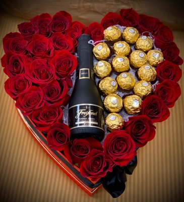With All My Heart - Featuring a mix of 24 red roses, 16 pcs Ferrero Rocher Chocolate, and Freixenet Cordon Negro Brut Cava Champaign (187 ml). You must be 21 years of age or older to order, purchase or receive delivery of wine. A person who is 21 years of age or older must be home to sign for the delivery. With All My Heart - Featuring a mix of 24 red roses, 16 pcs Ferrero Rocher Chocolate, and Freixenet Cordon Negro Brut Cava Champaign (187 ml). You must be 21 years of age or older to order, purchase or receive delivery of wine. A person who is 21 years of age or older must be home to sign for the delivery.