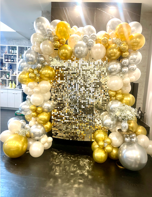 Despina's Bridal Shower - Disco/Sequin Backdrop with 3 different colors of balloons. Fresh baby's breath incorporated throughout the display.