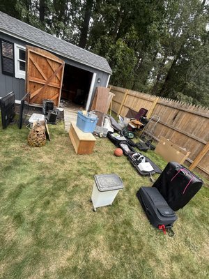 Shed Cleanout - Old shed with previous tenants items. Snap your fingers and it’s gone!