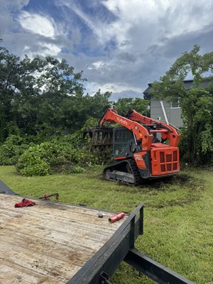 Land clearing and junk removal - This job was a company that needed a land to be cleared from all trees and debris to get ready to be sold . We also had to remove all roots and trees that had grown inside the fence so that the company would be able to install new aluminum fence .