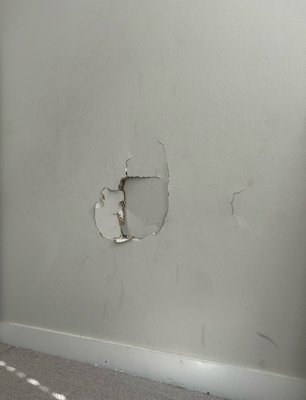 Drywall repair - A simple drywall patch from someone falling into the wall. Drywall repair - A simple drywall patch from someone falling into the wall.