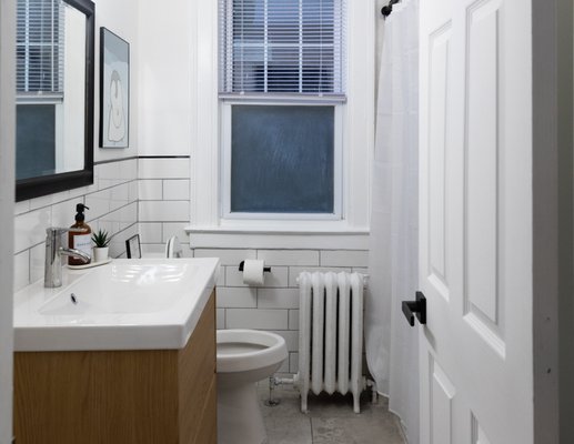 Bathroom refresh - Experience the transformation of an outdated bathroom into a sleek, modern oasis. We began by completely gutting the walls to install fresh, contemporary tiles that brighten and open the space. Next, we laid down brand-new flooring for a cohesive, stylish foundation. Finally, we added a floating vanity, blending practical storage solutions with an airy, sophisticated look. The result is a stunning bathroom refresh that perfectly combines comfort, functionality, and timeless appeal.