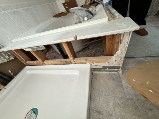 Rental property bathroom leak & repair - Client had a leak caused by a defective shower pan and had the pan replaced by their plumber. We came in and determined that replacing the waterproofing and tile would be the best option for longevity of the shower. We were able to do new tile, shower valve, waterproofing and reuse the shower door all within the clients budget