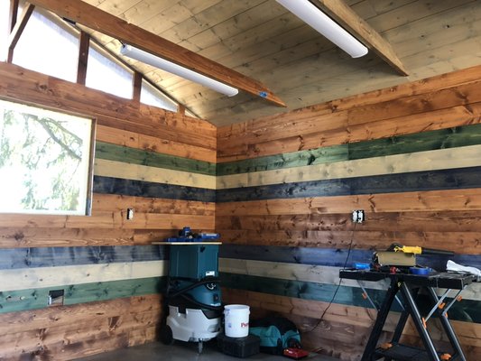 Detached garage renovation into art studio - This renovation started as a detached shed/garage 200 feet away from the house. All that was in the shed was an oil stained cement pad, exposed 2x4 studs and 1 window in the back.
To convert the shed into an art studio I had to run 240v power with a sub panel and water to it in a 200’ trench!
After that we reframed the left wall for the two new windows, ran electrical through out the shed for heaters, outlets, lights and a fridge.
Once that was done it was time to insulate then stain and install the shiplap with laser straight lines and joints due to my customers OCD.
after the window trim was installed we made up a custom metal topped work bench/countertop on top of the cabinetry.
All in all a beautiful space and I’m proud to have built it. Detached garage renovation into art studio - This renovation started as a detached shed/garage 200 feet away from the house. All that was in the shed was an oil stained cement pad, exposed 2x4 studs and 1 window in the back.
To convert the shed into an art studio I had to run 240v power with a sub panel and water to it in a 200’ trench!
After that we reframed the left wall for the two new windows, ran electrical through out the shed for heaters, outlets, lights and a fridge.
Once that was done it was time to insulate then stain and install the shiplap with laser straight lines and joints due to my customers OCD.
after the window trim was installed we made up a custom metal topped work bench/countertop on top of the cabinetry.
All in all a beautiful space and I’m proud to have built it.