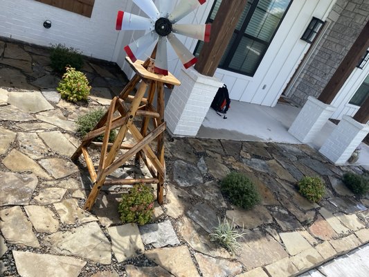 Flagstone garden bed and steps - This was a garden bad I had pulled weeds from. Client had flagstone available and wanted steps between neighbor's house and there's as well as the garden bed cleaned out and replaced with flagstone and rocks to fill the cracks.