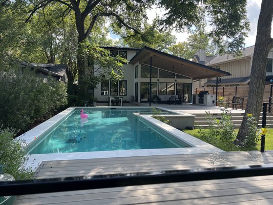 Poolside deck - This was an awesome poolside deck with French White Oak composite decking and a custom cable rail. This thing turned out so nice. We were really excited to work on this one Poolside deck - This was an awesome poolside deck with French White Oak composite decking and a custom cable rail. This thing turned out so nice. We were really excited to work on this one