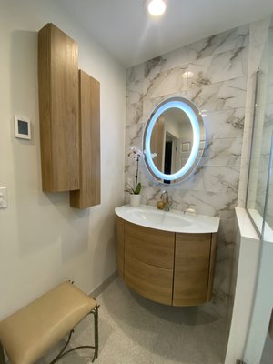 Modern Italian Primary Bath Addition - Added a second floor addition for a primary en-suite and walk-in closet combination. Bathroom inludes wall mounted italian vanity, walk in shower with custom shower bench, wall niche and toilet nook and radiant heat flooring.