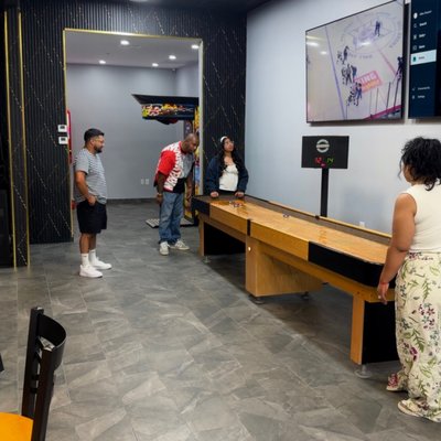 Game On Lounge - Not everyone wants to swing a club or race a car. Sometimes you just want to hang out.
The Game On Lounge is built for that.
We’ve got pool tables, darts, shuffleboard, and Golden Tee ready to go. Step up and compete, or just play a casual game while you catch up with friends. There’s even a punching bag if you want to burn off some energy between rounds.
Grab a beer. Pour a glass of wine. Order some food and stay awhile.
We’re serving crowd favorites like pizza, chicken, and easy bar snacks that actually hit the spot. Nothing complicated. Just good food that pairs well with a cold drink and a little competition.
This is the spot for:
After-work hangouts
Weekend meetups
Birthday parties
League nights
Or just a night out that isn’t the usual scene
You can start in the simulators and end in the lounge. Or skip the tech and post up here all night.
Game On isn’t just about golf. It’s about having a place where everyone has something to do.
Phone: 623-213-7535 Game On Lounge - Not everyone wants to swing a club or race a car. Sometimes you just want to hang out.
The Game On Lounge is built for that.
We’ve got pool tables, darts, shuffleboard, and Golden Tee ready to go. Step up and compete, or just play a casual game while you catch up with friends. There’s even a punching bag if you want to burn off some energy between rounds.
Grab a beer. Pour a glass of wine. Order some food and stay awhile.
We’re serving crowd favorites like pizza, chicken, and easy bar snacks that actually hit the spot. Nothing complicated. Just good food that pairs well with a cold drink and a little competition.
This is the spot for:
After-work hangouts
Weekend meetups
Birthday parties
League nights
Or just a night out that isn’t the usual scene
You can start in the simulators and end in the lounge. Or skip the tech and post up here all night.
Game On isn’t just about golf. It’s about having a place where everyone has something to do.
Phone: 623-213-7535