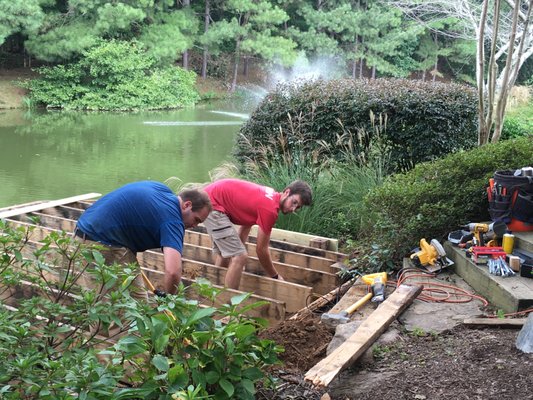 Canal-side Deck Renovation - This fun project on a beautiful canal neighborhood involved excavation to remove two rotten ledger boards and then installing new railing and decking.