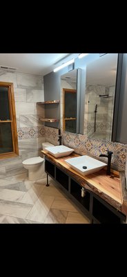 Bathroom remodel - New tile up alone the entire wall and floor with a custom made vanity. Bathroom remodel - New tile up alone the entire wall and floor with a custom made vanity.