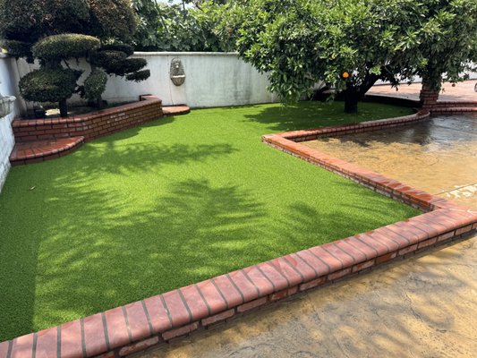 Artificial grass Around an Orange Tree - Low maintenance and beautiful green year-round. Artificial grass Around an Orange Tree - Low maintenance and beautiful green year-round.
