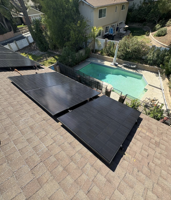 Solar Panel Installation, Santa Clarita, CA - This 8-panel-project showcases a custom solar PV design tailored to a complex roof structure. The installation required navigating multiple roof planes, seamlessly integrating arrays across both pitched asphalt shingle sections and a central flat roof area. Solar Panel Installation, Santa Clarita, CA - This 8-panel-project showcases a custom solar PV design tailored to a complex roof structure. The installation required navigating multiple roof planes, seamlessly integrating arrays across both pitched asphalt shingle sections and a central flat roof area.