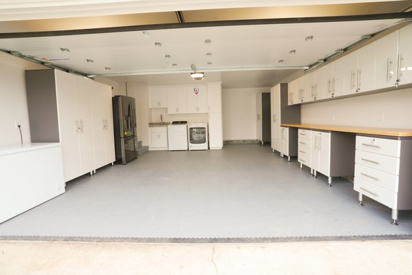 Garage remodel - Genevieve’s family project was a rewarding experience for us, and we are thrilled with the outcome. We left them delighted with their newly renovated kitchen, bathroom, and garage—check out their statement below!
To enhance the kitchen’s functionality, we relocated it from a smaller room to a larger space, making use of the extra area available. The result is a spacious, highly functional kitchen featuring a beautiful quartzite countertop, sleek stainless steel appliances, black hardware on white shaker-style cabinets, and a large window over the sink that brings in plenty of natural light. We also installed additional lighting to create a bright and cozy atmosphere.
Beyond the kitchen, we were honored to remodel their garage, partially renovate their master bathroom, and install waterproof laminate flooring throughout most of the house.
In the garage, we insulated the walls and ceiling, replaced the old roll-out door with an insulated one, refinished the drywall to a smooth finish, and installed durable diamond plate tile flooring. We also designed a practical laundry area and added extensive cabinetry to maximize functionality.
For the master bathroom, we addressed a leakage issue by replacing the bathtub and correcting faulty plumbing. We ensured proper waterproofing, installed elegant tile up to the ceiling, incorporated a spacious shampoo niche, and completed the look with a high-quality Delta glass installation.
We are proud of the transformation and grateful for the opportunity to bring this vision to life. Take a look at the before pictures below and celebrate the results with us! Garage remodel - Genevieve’s family project was a rewarding experience for us, and we are thrilled with the outcome. We left them delighted with their newly renovated kitchen, bathroom, and garage—check out their statement below!
To enhance the kitchen’s functionality, we relocated it from a smaller room to a larger space, making use of the extra area available. The result is a spacious, highly functional kitchen featuring a beautiful quartzite countertop, sleek stainless steel appliances, black hardware on white shaker-style cabinets, and a large window over the sink that brings in plenty of natural light. We also installed additional lighting to create a bright and cozy atmosphere.
Beyond the kitchen, we were honored to remodel their garage, partially renovate their master bathroom, and install waterproof laminate flooring throughout most of the house.
In the garage, we insulated the walls and ceiling, replaced the old roll-out door with an insulated one, refinished the drywall to a smooth finish, and installed durable diamond plate tile flooring. We also designed a practical laundry area and added extensive cabinetry to maximize functionality.
For the master bathroom, we addressed a leakage issue by replacing the bathtub and correcting faulty plumbing. We ensured proper waterproofing, installed elegant tile up to the ceiling, incorporated a spacious shampoo niche, and completed the look with a high-quality Delta glass installation.
We are proud of the transformation and grateful for the opportunity to bring this vision to life. Take a look at the before pictures below and celebrate the results with us!
