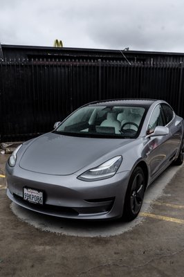 Tesla Model 3 Full front end PPF - Cruising into the future in style! Our latest Tesla Model 3 owner just drove off the lot, and their first pit stop? Our studio, where we transformed their sleek ride into a masterpiece of protection. With our advanced paint protection film, this Model 3 isn't just turning heads; it's defying time. Every curve, every shine - all now shielded against the elements. Ready to stand out on the road, protected and unstoppable. Tesla Model 3 Full front end PPF - Cruising into the future in style! Our latest Tesla Model 3 owner just drove off the lot, and their first pit stop? Our studio, where we transformed their sleek ride into a masterpiece of protection. With our advanced paint protection film, this Model 3 isn't just turning heads; it's defying time. Every curve, every shine - all now shielded against the elements. Ready to stand out on the road, protected and unstoppable.
