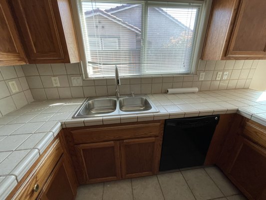 Los Baños,CA - In this property we made a change by installing a new floor and changing the color of the interior. The cabinets were degreased and a new sink and microwave were installed.