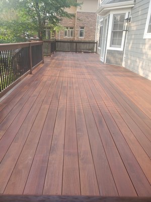 Deck refinishing Project - This was an ipe wood deck that hasn't been refinished for many years. Wehad power washed it, lightly sanded it and applied a coat of stain to make it look like new again.