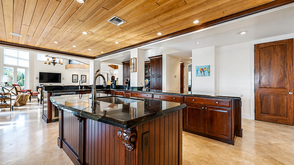 Custom Home - This custom oceanfront residence was designed and built to capture the essence of coastal living while delivering a refined, high-performance home tailored for both entertaining and everyday comfort. Positioned steps from the water, the home maximizes panoramic views and natural light through expansive glazing and an open, flowing floor plan.
The architectural design blends warm natural materials with clean, modern lines—highlighted by custom wood ceiling treatments, wide-open living spaces, and seamless indoor-outdoor transitions. The main living area features soaring ceilings and large-format openings that connect directly to exterior terraces, creating a continuous visual and functional connection to the surrounding landscape.
At the heart of the home, a fully custom kitchen anchors the space with rich wood cabinetry, oversized stone countertops, and integrated appliances. The layout was carefully designed to support both large gatherings and everyday use, with a focus on durability, flow, and craftsmanship.
A sculptural floating staircase with wood treads and glass railing serves as a central architectural feature, reinforcing the home’s modern aesthetic while maintaining openness between levels. Throughout the residence, high-end finishes and detailed millwork elevate each space without overwhelming the clean, coastal palette.
Outdoor living was a key priority in the design. The property includes a resort-style pool and spa, expansive covered patio areas, and multiple lounge and entertainment zones—all positioned to take full advantage of ocean views and coastal breezes. A covered outdoor living area with integrated lighting and ceiling treatments extends the usability of the space year-round. Custom Home - This custom oceanfront residence was designed and built to capture the essence of coastal living while delivering a refined, high-performance home tailored for both entertaining and everyday comfort. Positioned steps from the water, the home maximizes panoramic views and natural light through expansive glazing and an open, flowing floor plan.
The architectural design blends warm natural materials with clean, modern lines—highlighted by custom wood ceiling treatments, wide-open living spaces, and seamless indoor-outdoor transitions. The main living area features soaring ceilings and large-format openings that connect directly to exterior terraces, creating a continuous visual and functional connection to the surrounding landscape.
At the heart of the home, a fully custom kitchen anchors the space with rich wood cabinetry, oversized stone countertops, and integrated appliances. The layout was carefully designed to support both large gatherings and everyday use, with a focus on durability, flow, and craftsmanship.
A sculptural floating staircase with wood treads and glass railing serves as a central architectural feature, reinforcing the home’s modern aesthetic while maintaining openness between levels. Throughout the residence, high-end finishes and detailed millwork elevate each space without overwhelming the clean, coastal palette.
Outdoor living was a key priority in the design. The property includes a resort-style pool and spa, expansive covered patio areas, and multiple lounge and entertainment zones—all positioned to take full advantage of ocean views and coastal breezes. A covered outdoor living area with integrated lighting and ceiling treatments extends the usability of the space year-round.