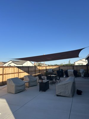 Shade Sail Installation – Backyard Patio - Installed a sun shade sail over a backyard patio to provide comfortable shade and improve the outdoor space. All hardware was securely mounted and tensioned for a clean, professional look.