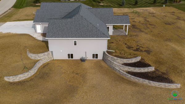 Retaining Walls - This customer built a new home with open basement concept.  Which in return needed Retaining walls. We opted to do a Design that would be above the normal. We executed this plan to quality along with stunning views.