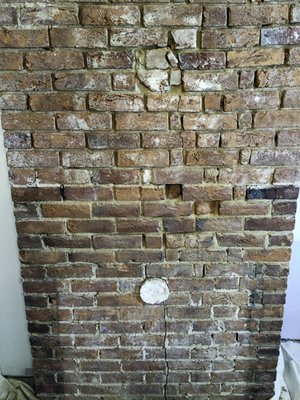 Exposed Chimney - This chimney was exposed while remodeling an old home in Loudoun County.  Hearthstone Chimney and Masonry used lime mortar and salvaged antique bricks to restore the chimney to it's original condition.