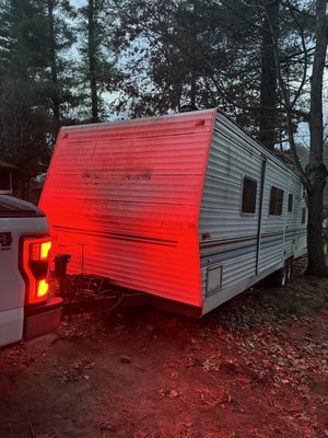 Stuck 30 foot Camper Removal - This client let a friend use her camper for years, he finally dropped it off, leaving it pinned between 2 trees , crooked on a hill, surrounded by sand! How he managed that, we’re not sure, but we got it out! On top of that, our client had a super tight budget so we had to work with that we had, a chain , and a truck.
What looks like an easy hookup and go , was the furthest thing from it. We spent roughly 8 hours pivoting and carefully adjusting this camper to turn it around 180° to hookup and drive away. I wish I had more photos to capture the true experience of this one. Stuck 30 foot Camper Removal - This client let a friend use her camper for years, he finally dropped it off, leaving it pinned between 2 trees , crooked on a hill, surrounded by sand! How he managed that, we’re not sure, but we got it out! On top of that, our client had a super tight budget so we had to work with that we had, a chain , and a truck.
What looks like an easy hookup and go , was the furthest thing from it. We spent roughly 8 hours pivoting and carefully adjusting this camper to turn it around 180° to hookup and drive away. I wish I had more photos to capture the true experience of this one.