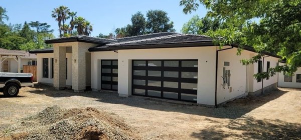 Garage Door Replacement or Installation - Whether your garage is newly built or you’re looking for a replacement garage door, we can install a beautiful and functional door for you quickly and economically.
Choose what you want from a variety of styles and we’ll do the rest for your garage door replacement or installation.
If you aren’t sure which style is right for you, feel free to get in touch with us and tell us about your needs and concerns regarding garage door installation and we can help you decide. Garage Door Replacement or Installation - Whether your garage is newly built or you’re looking for a replacement garage door, we can install a beautiful and functional door for you quickly and economically.
Choose what you want from a variety of styles and we’ll do the rest for your garage door replacement or installation.
If you aren’t sure which style is right for you, feel free to get in touch with us and tell us about your needs and concerns regarding garage door installation and we can help you decide.