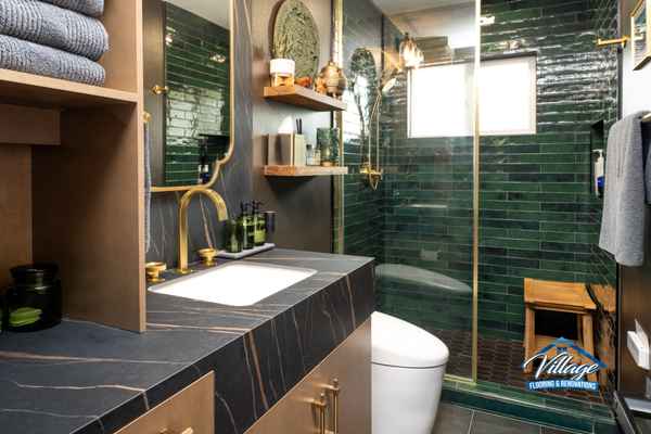 Moody Spa-Inspired Green Tile Bathroom - This luxury bathroom renovation blends rich green handcrafted-look tile with warm wood cabinetry and brushed brass fixtures. Designed to evoke a boutique spa experience, the space includes a custom vanity, frameless glass shower, integrated storage, floating shelving, and designer lighting. The result is a sophisticated retreat that balances natural textures with modern functionality. Moody Spa-Inspired Green Tile Bathroom - This luxury bathroom renovation blends rich green handcrafted-look tile with warm wood cabinetry and brushed brass fixtures. Designed to evoke a boutique spa experience, the space includes a custom vanity, frameless glass shower, integrated storage, floating shelving, and designer lighting. The result is a sophisticated retreat that balances natural textures with modern functionality.