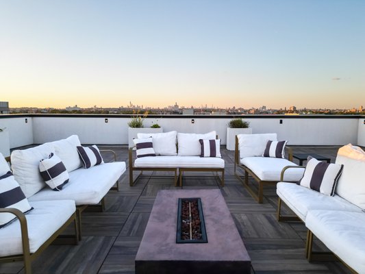 Rooftop Terrace in Midwood, Brooklyn - We worked closely with the building contractor to complete this shared rooftop terrace in Midwood, Brooklyn. Featuring porcelain pavers, a central fire pit, and ambient lighting, this rooftop provides residents with a stylish and modern space to relax and enjoy the views. Rooftop Terrace in Midwood, Brooklyn - We worked closely with the building contractor to complete this shared rooftop terrace in Midwood, Brooklyn. Featuring porcelain pavers, a central fire pit, and ambient lighting, this rooftop provides residents with a stylish and modern space to relax and enjoy the views.