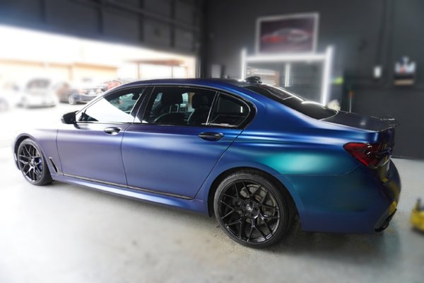 2016 BMW 750LI - BMW 750Li – Satin Frozen Ocean Wrap + 5-Year Ceramic Coating
Step 1: Surface Prep
Thorough cleaning and decontamination of all exterior surfaces
Light polishing to ensure a smooth, flawless base for wrap adhesion
Step 2: Full Vehicle Wrap Installation
Applied Avery Dennison Satin Frozen Ocean wrap to the entire vehicle
Exotic satin blue finish enhances body lines with a unique, premium look
Precision installation with seamless edges and perfect panel alignment
Step 3: Ceramic Coating Application
Applied a 5-year ceramic coating over the entire wrapped surface
Adds deep gloss and enhances the satin texture without altering the finish
Provides hydrophobic protection, UV resistance, and easier maintenance
Result:
A completely transformed BMW 750Li with a bold, elegant look
Long-lasting protection and enhanced finish
Showroom-quality craftsmanship, done by Med Tint 2016 BMW 750LI - BMW 750Li – Satin Frozen Ocean Wrap + 5-Year Ceramic Coating
Step 1: Surface Prep
Thorough cleaning and decontamination of all exterior surfaces
Light polishing to ensure a smooth, flawless base for wrap adhesion
Step 2: Full Vehicle Wrap Installation
Applied Avery Dennison Satin Frozen Ocean wrap to the entire vehicle
Exotic satin blue finish enhances body lines with a unique, premium look
Precision installation with seamless edges and perfect panel alignment
Step 3: Ceramic Coating Application
Applied a 5-year ceramic coating over the entire wrapped surface
Adds deep gloss and enhances the satin texture without altering the finish
Provides hydrophobic protection, UV resistance, and easier maintenance
Result:
A completely transformed BMW 750Li with a bold, elegant look
Long-lasting protection and enhanced finish
Showroom-quality craftsmanship, done by Med Tint