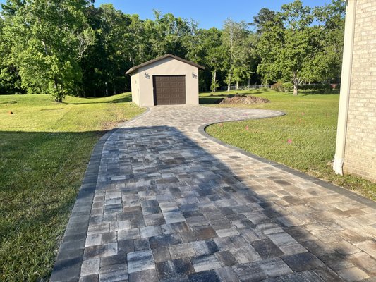 Driveway - Driveway Installed using Mega Olde Towne pavers, Lionsbrigde color with granite border.