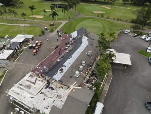 Olomana Golf Course - The roof at the main building was leaking, and had 3 layers of shingles that were breaking apart. We removed all the layers, repaired a lot of wood rot, and installed a new roof. With a 50 year synthetic underlayment, and solar reflective shingles, the new building stays dry and much cooler in the hot sun.