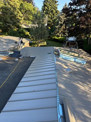 Metal Re roof - This Roof conversion was done from very old cedar shakes roof to snap lock metal roof to give house a very modern and elegant look and a lifelong roof with very low maintenance over the lifespan of roof. Metal Re roof - This Roof conversion was done from very old cedar shakes roof to snap lock metal roof to give house a very modern and elegant look and a lifelong roof with very low maintenance over the lifespan of roof.