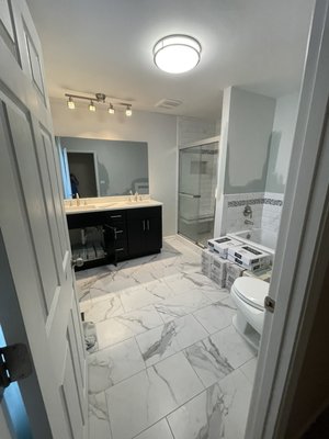 Bathroom shower Remodel shower pan replacement - Remove and Replace shower pan, walls, move drain keep wall valve customer supplied material