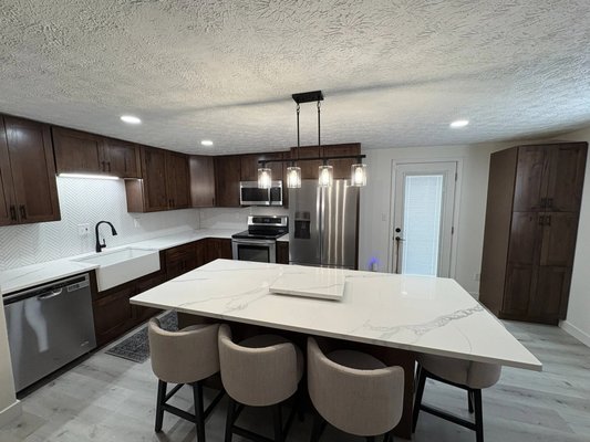 Kitchen Remodels - Transform your kitchen into a modern, functional, and beautiful space tailored to your lifestyle. This remodel includes updated cabinetry, countertops, and appliances, improved lighting, and an optimized layout to enhance both aesthetics and usability. The design focuses on maximizing storage, increasing energy efficiency, and creating an inviting atmosphere for cooking, entertaining, and everyday living.