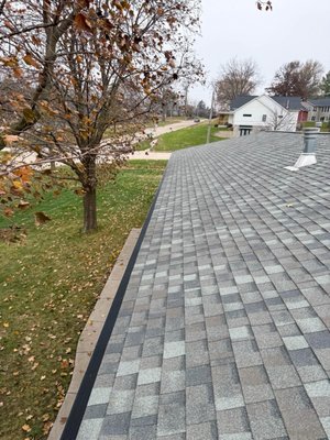 Gutter Guards - Bettendorf, IA - Living with beautiful, large tree's in Bettendorf is great until autumn hits and the gutters pay the price. This homeowner was tired of the endless cycle of climbing ladders to clear out clogs, so we stepped in to provide a low-maintenance solution. 

We installed the RainDrop Gutter Guard system, which is specifically designed to handle heavy water flow while keeping leaves, twigs, and pine needles from ever entering the trough. Now the rainwater flows freely and the homeowner can stay safely on the ground, knowing their gutters are protected and debris-free year round.