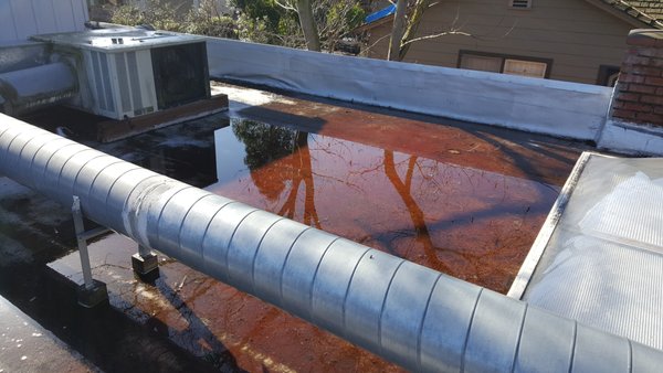 Multiple Unit Home In Hillsborough, Ca With A Flat Roof - This flat roof had absolutely no slope for water to drain properly into the drain outlets, When it rained, There was 2-3-Inches of water standing on the entire roof. Another challenge on this roof was the inside had exposed ceilings, We made a design to nail the new roof system to the studs we had built inn between the taper insulation system. Multiple Unit Home In Hillsborough, Ca With A Flat Roof - This flat roof had absolutely no slope for water to drain properly into the drain outlets, When it rained, There was 2-3-Inches of water standing on the entire roof. Another challenge on this roof was the inside had exposed ceilings, We made a design to nail the new roof system to the studs we had built inn between the taper insulation system.
